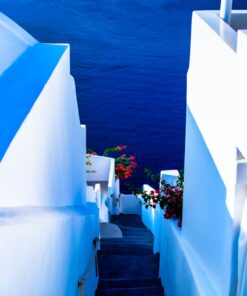 white concrete staircase near body of water during daytime